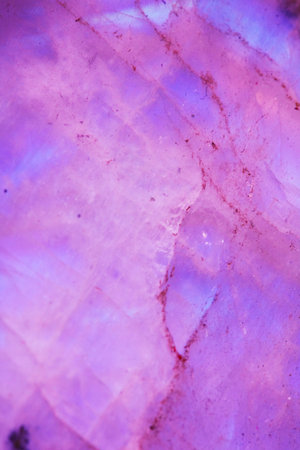 Beautiful close up of quartz crystal rock shard with reflective rainbow spiritual lightの写真素材