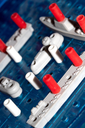 Close up of strategic battleships board game with ships and pegs