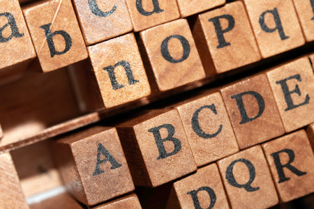 Jumbled up block wood print letters lined upの写真素材