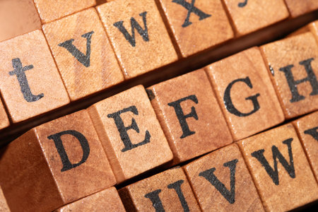 Jumbled up block wood print letters lined up