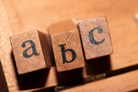 Jumbled up block wood print letters lined upの写真素材