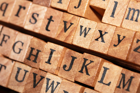 Jumbled up block wood print letters lined upの写真素材