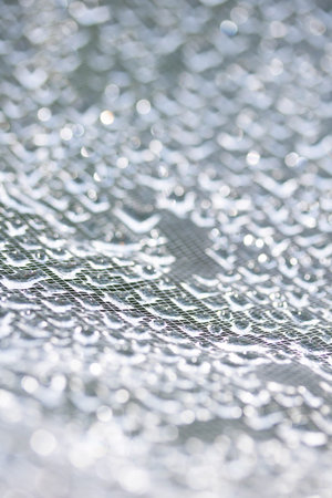 Abstract water liquid droplets on lace lines boketh soft beautiful backgroundの写真素材