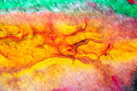 Thick swirling abstract acrylic color paint vivid creative backgroundの写真素材