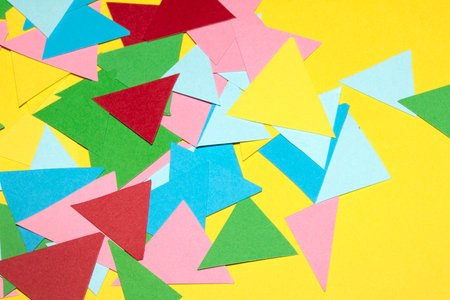 Simple Paper Card Primary Colour Triangle Geometric Shapes in Multicolour Rainbow Calm Backgroundの写真素材