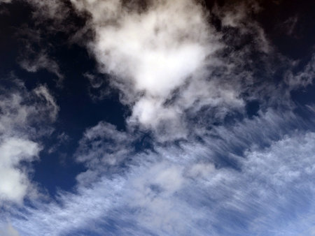 Clouds in the blue sky as a background, horizontal image.の写真素材