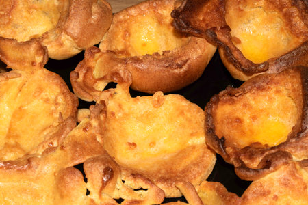 Close up of home made Yorkshire Puddings in roasting tin