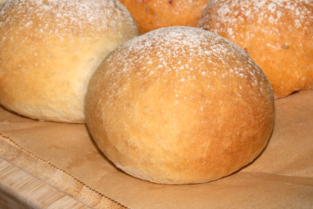 Close up of fresh baked homemade rolls buns breads golden