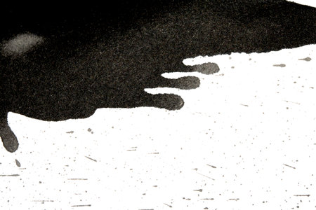 Distressed Monochrome Ink Circle Texture and Splatter Graphic on white background