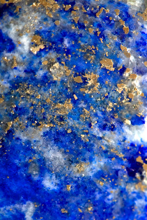 Close up of lapis lazuli blue and gold crystal gemstone harmony backgroundの写真素材