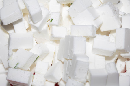 Close up white cube vegan feta cheese sliced foodの写真素材