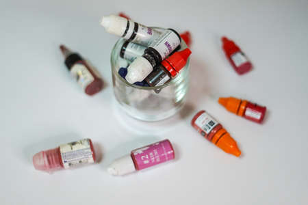 Set of color correction ink bottle for cosmetic tattoo. Many Microblading Permanent Makeup Pigments in Bottled Store, Beauty Salon. Odessa, Ukraine - November 17, 2020のeditorial素材