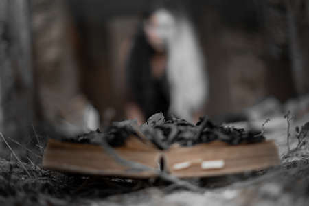 antiques, antique books piling up, selective focus, stack of old books, old book, magic books in the room of darkness, books for witchesの写真素材