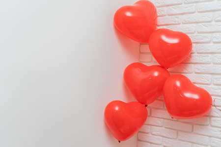 heart shaped balloons on a white background, wedding concept, valentine's day, photo zone, sweethearts, love concept, holiday, wedding decoration, bachelorette party, red inflatable heart on a white background, Holiday card, Love concept in the air, Heart balloonsの写真素材
