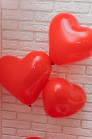 heart shaped balloons on a white background, wedding concept, valentine's day, photo zone, sweethearts, love concept, holiday, wedding decoration, bachelorette party, red inflatable heart on a white background, Holiday card, Love concept in the air, Heart balloonsの写真素材