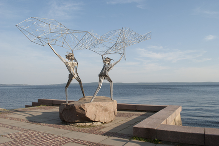 sculpture of fishermen on the waterfrontの写真素材