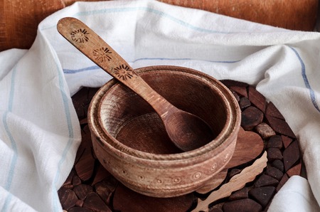 Household utensils on a stand made of woodの写真素材
