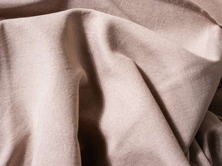 view from above. texture and background. beige fabric.