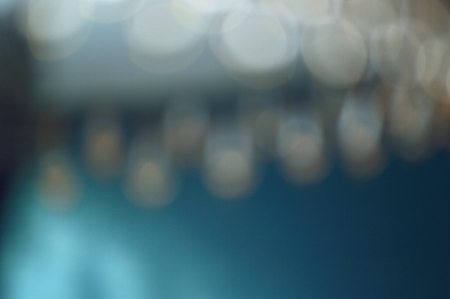 A curl of hazy orange lights against a blue background
