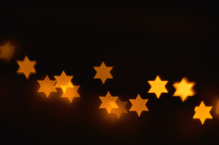 Beautiful bokeh lights in shape of the Star of David for Hanukkah celebration. Jewish Holiday...
