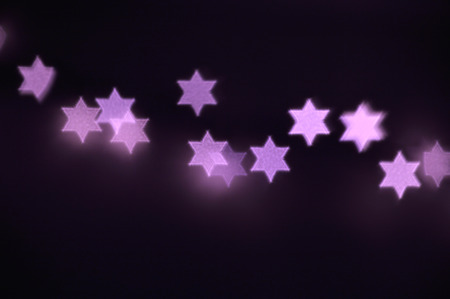 Beautiful bokeh lights in shape of the Star of David for Hanukkah celebration. Jewish Holiday...