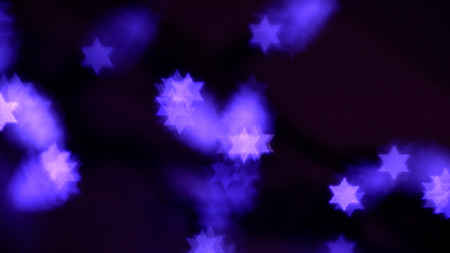 Beautiful bokeh lights in shape of the Star of David for Hanukkah celebration. Jewish Holiday background.の写真素材