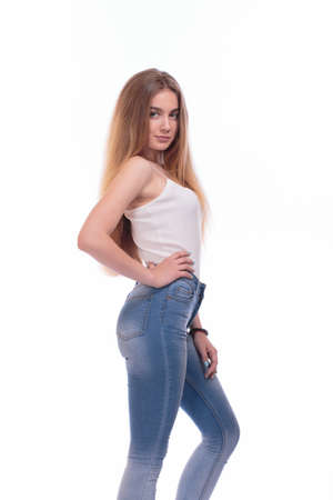 Beautiful young woman posing. Isolated on a white backgroundの写真素材