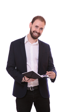 man standing with notebook and making remarksの写真素材