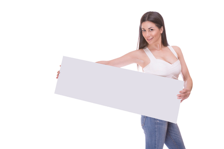 Young woman holding blank poster isolated on white backroundの写真素材