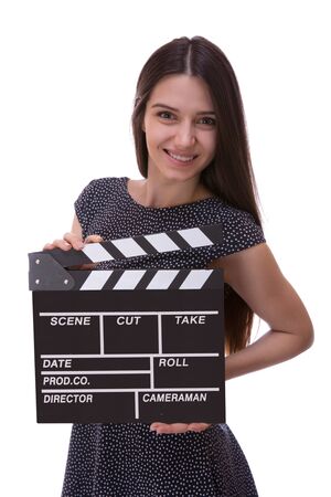 Attractive young girl holding clapper board isolated on white backgroundの写真素材