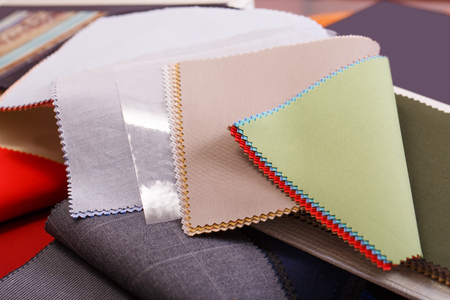 Close-up detail of multicolor elite fabric textile samples with copy spaceの写真素材