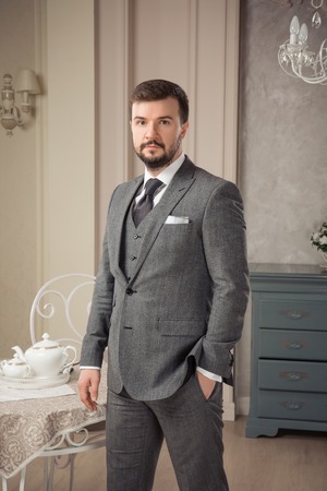 Handsome elegant young man in classic vintage apartments. Fashion. Luxury.の写真素材
