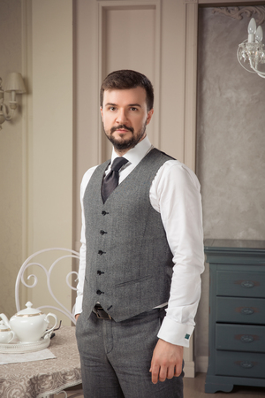 Handsome elegant young man in classic vintage apartments. Fashion. Luxury.の写真素材