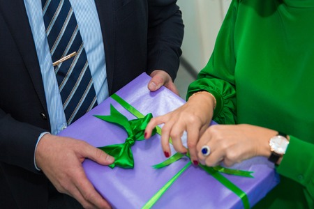 close up hands woman and man open gift box at Christmas party, holiday celebration. Happy New year. Surpriseの写真素材