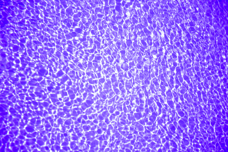 Violet Purple colored clear water. Crystal clear pool water. Best interior design ideas. Texture and Backgroundの写真素材