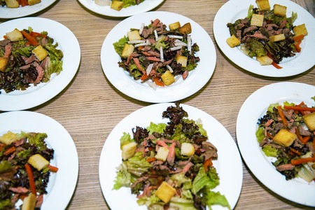 Healthy salads made of hot beef and fresh. a few plates