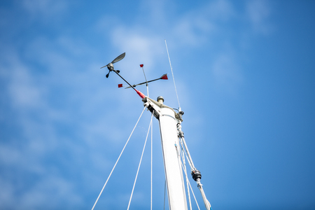 Mast of a white sailing yacht against the blue sky, copy spaceの写真素材