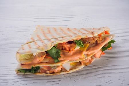 Grill Pita with shrimp and vegetables, served with a delicious sauce