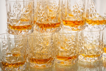 Many Glasses with whiskey at a buffet table or reception