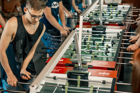KYIV, UKRAINE, bar league of Grants KickerKicker 10 June 2018. Active men and women have fun during table soccer game. Competitions and qualifying roundのeditorial素材
