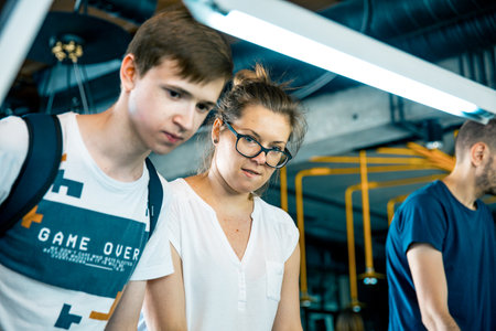 Photo KYIV, UKRAINE, bar league of Grants KickerKicker 10 June 2018. Active men and women have fun during table soccer game.のeditorial素材