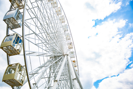 Ferris wheel on cloudy sky background. Copy spaceの写真素材