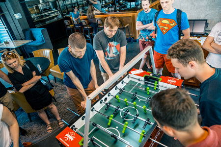KYIV, UKRAINE, bar league of Grants KickerKicker 10 June 2018. Active men and women have fun during table soccer game. championshipのeditorial素材