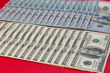 A pile of American paper hundred-dollar bills as an element of the world financial system.