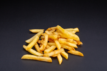 The Pile of french fries over black backgroundの写真素材