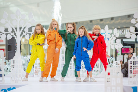 Kyiv, Ukraine March 03.2019. UKFW. Ukrainian Kids Fashion Day. A group of little girls singing or...