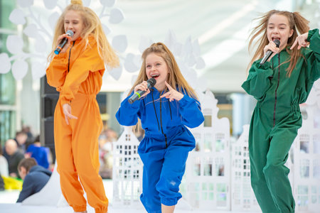 Kyiv, Ukraine March 03.2019. UKFW. Ukrainian Kids Fashion Day. A group of little girls singing or performing on stage or podiumのeditorial素材