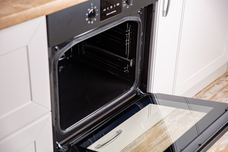New electric open oven in white modern kitchen