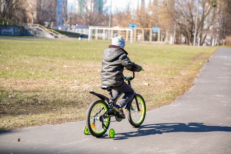 little boy riding runbike, early sport. walk. child learns to ride a bikeの写真素材