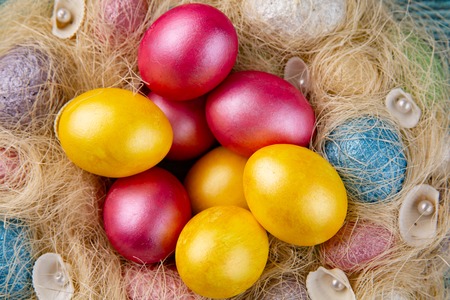 Easter eggs on wooden background. Colored eggs on blue wooden background